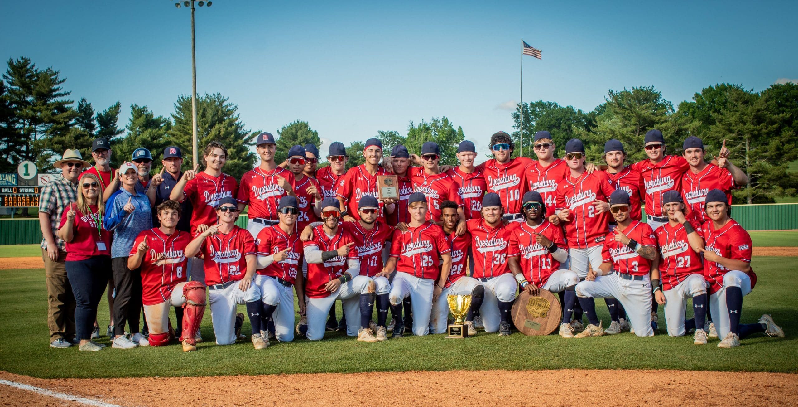 DSCC Baseball team champions with 2 trophies.